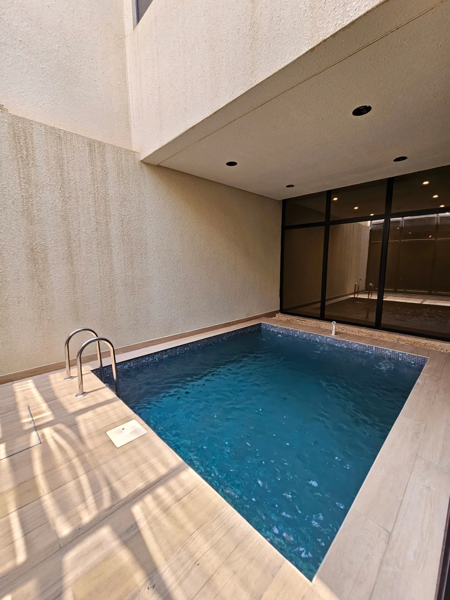 Villa for sale in Al Nayfa Compound, Al Munsiyah, Riyadh – pool view from the living area